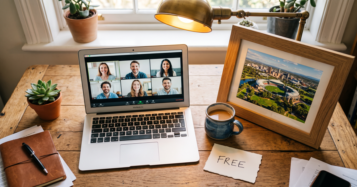 Laptop showing a Zoom recovery meeting with a framed photo of Adelaide Oval and parklands, free AA and NA meetings in Adelaide