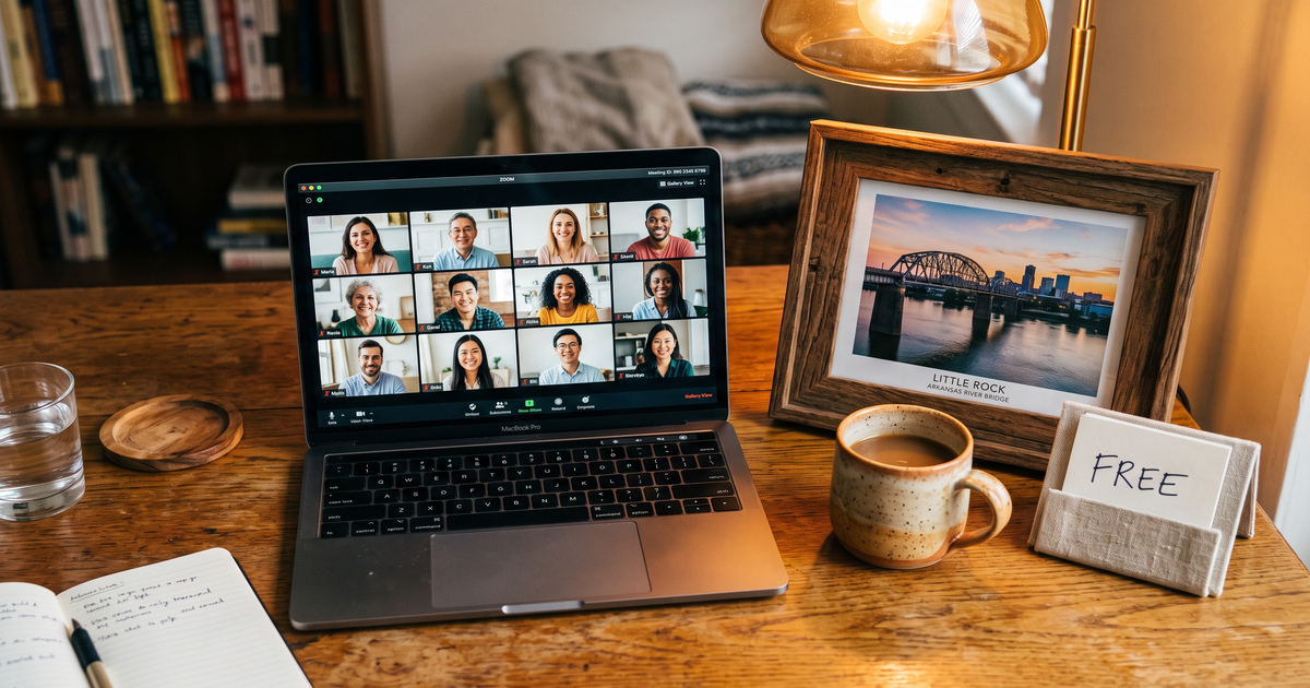 Laptop showing a Zoom recovery meeting with a framed photo of Little Rock Arkansas River bridge, free AA and NA meetings in Little Rock