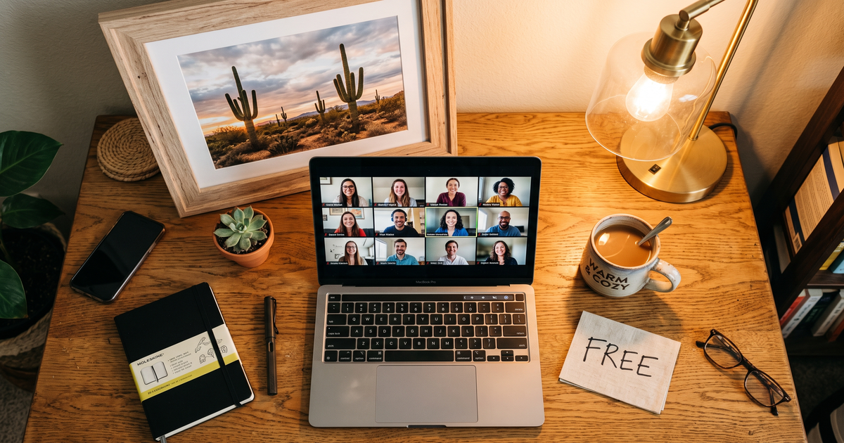 Laptop showing a Zoom recovery meeting with a framed photo of Saguaro cactus desert landscape, free AA and NA meetings in Tucson