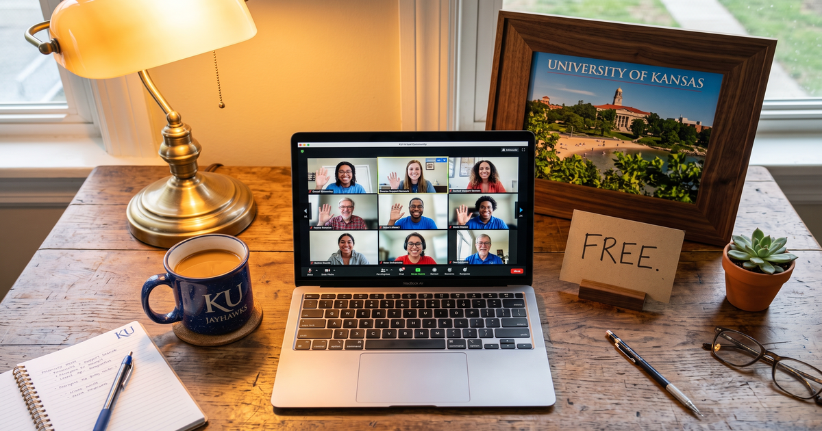 Laptop showing a Zoom recovery meeting with a framed photo of University of Kansas campus, free AA and NA meetings in Lawrence