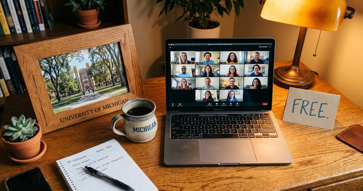 Laptop showing a Zoom recovery meeting with a framed photo of University of Michigan campus, free AA and NA meetings in Ann Arbor