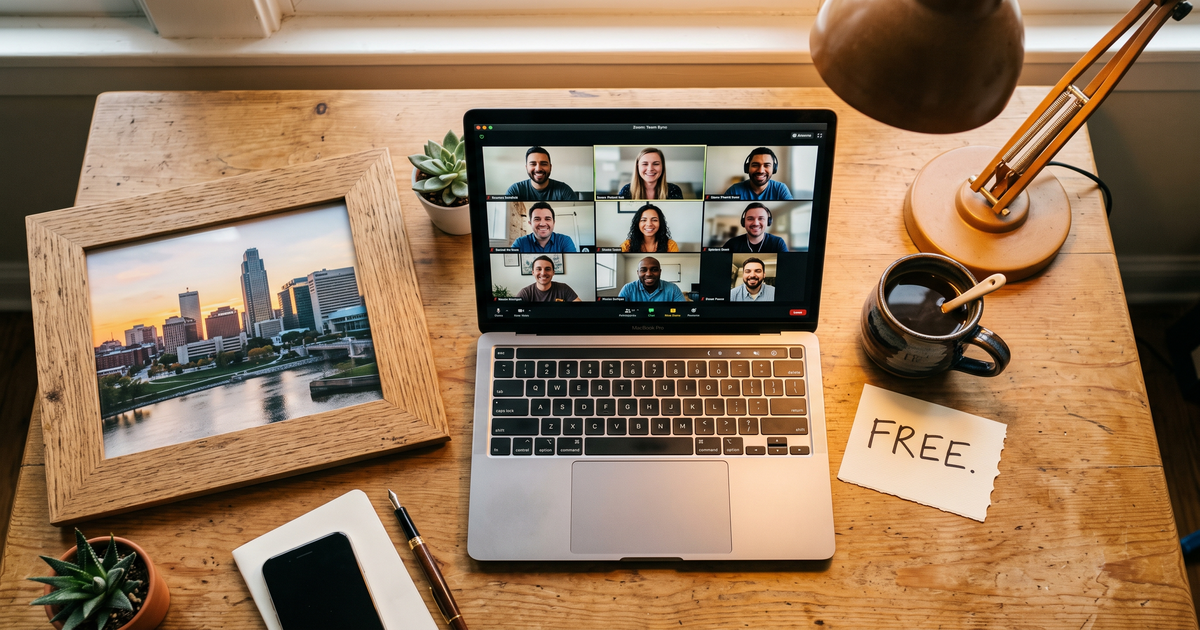 Laptop showing a Zoom recovery meeting with a framed photo of Omaha Nebraska skyline, free AA and NA meetings in Omaha