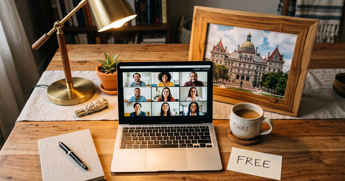 Laptop showing a Zoom recovery meeting with a framed photo of New York State Capitol building, free AA and NA meetings in Albany