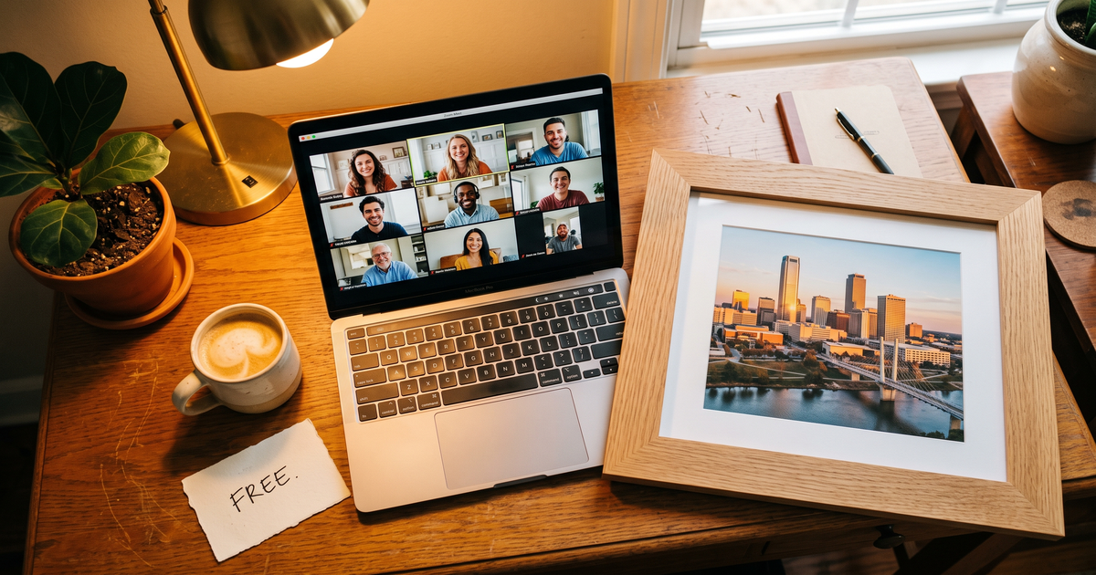 Laptop showing a Zoom recovery meeting with a framed photo of Tulsa skyline Arkansas River, free AA and NA meetings in Tulsa